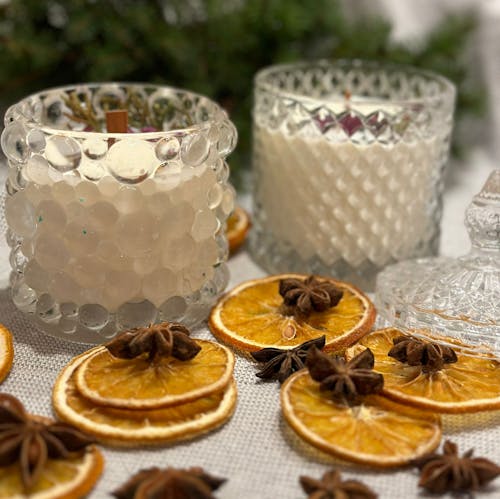Candles and Dried Oranges on a Table 