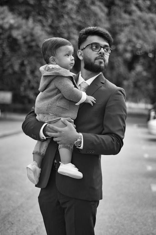 Father in Suit Holding Baby Son