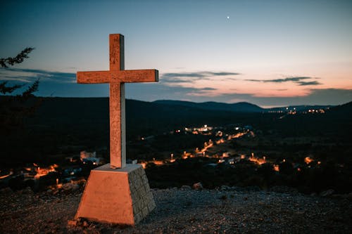 Cross on Hilltop over Village
