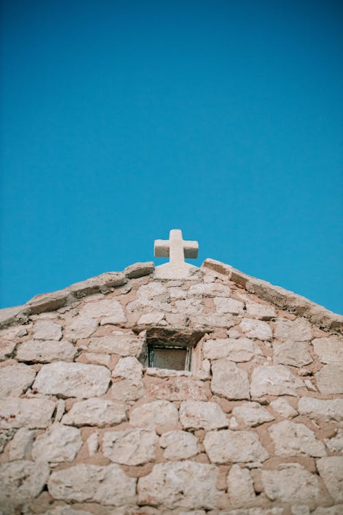 Stone Wall and Cross of Vintage Church