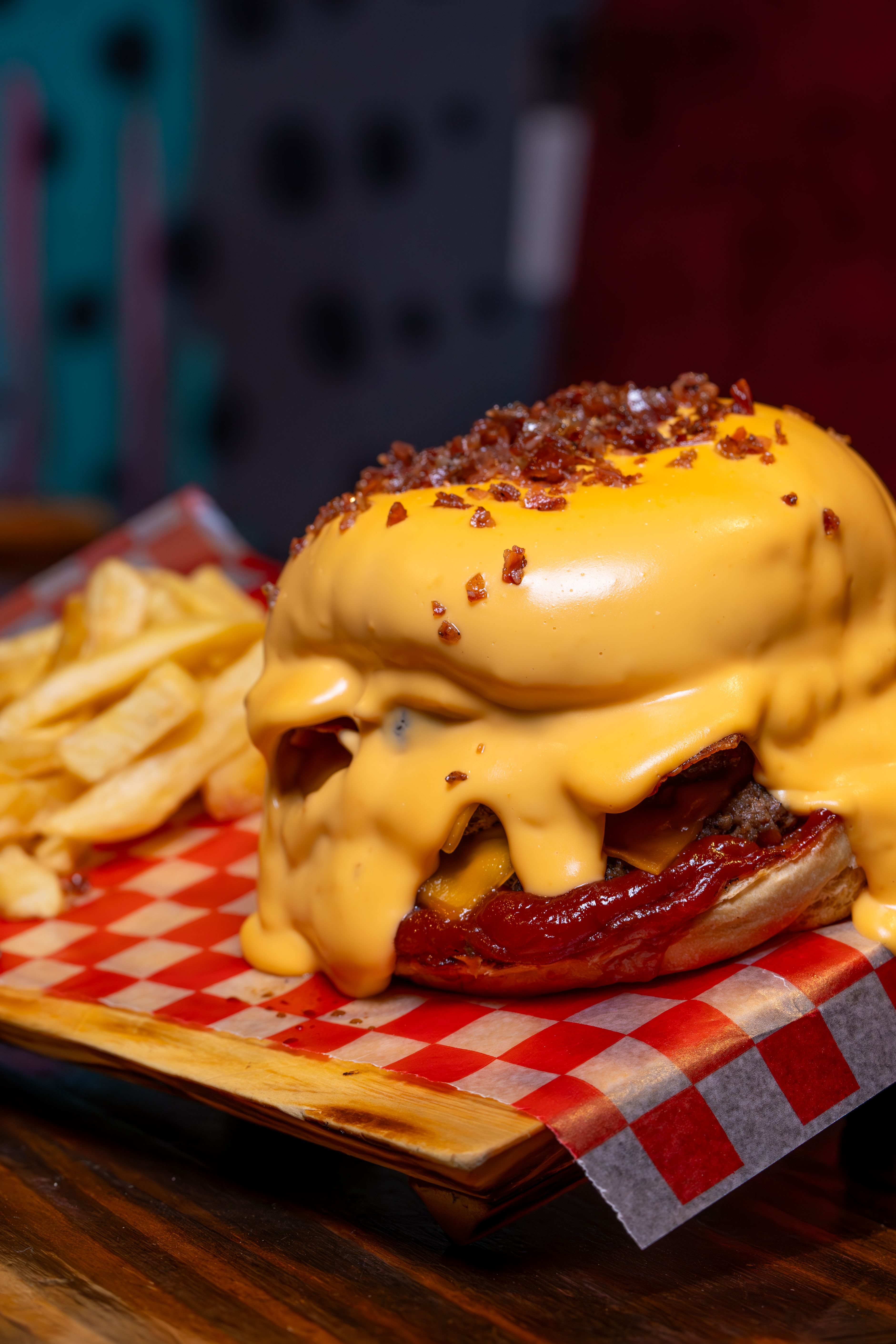Mouthwatering cheeseburger with melted cheese and fries, perfect for fast food lovers.