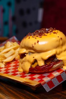 Mouthwatering cheeseburger with melted cheese and fries, perfect for fast food lovers.