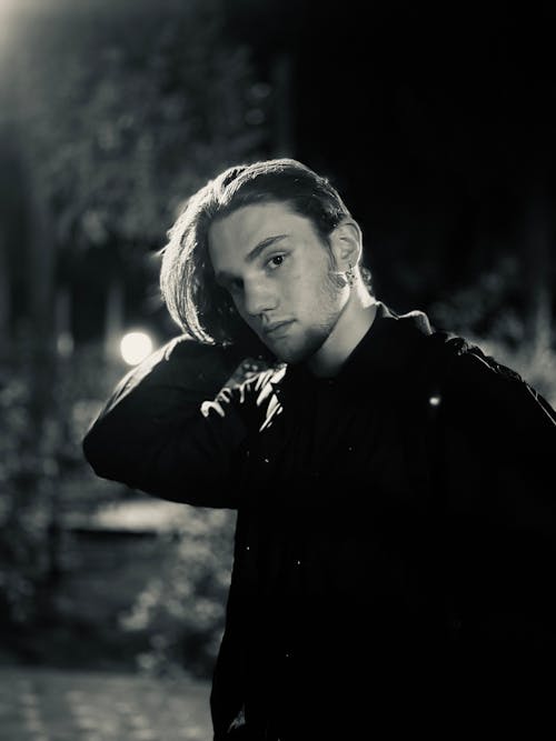 Black and White Portrait of a Young Man at Night