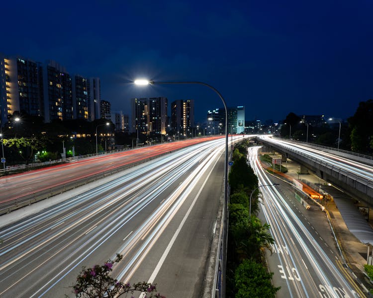 Empty Illuminated Highway At Night