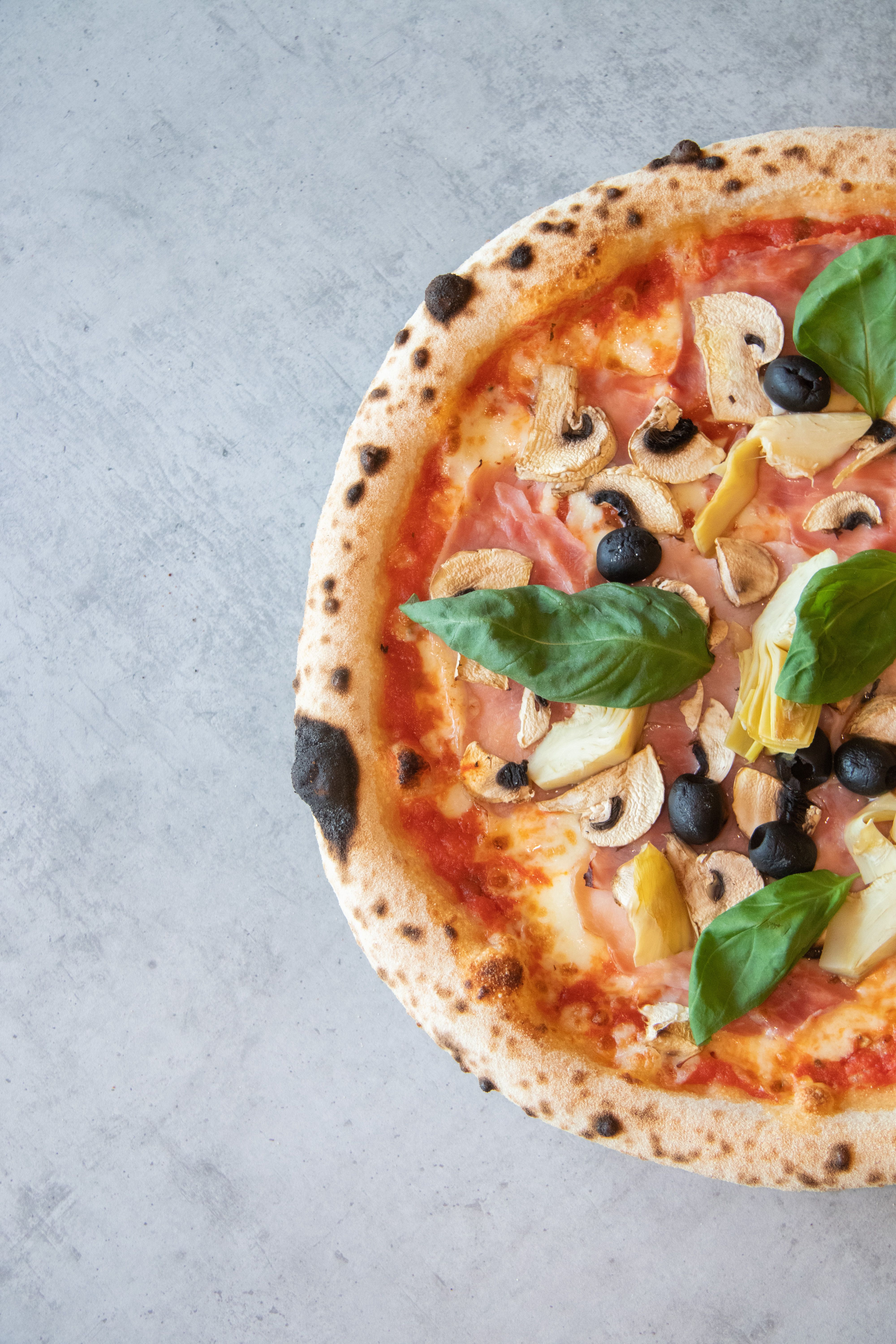 Freshly prepared pizza with toppings