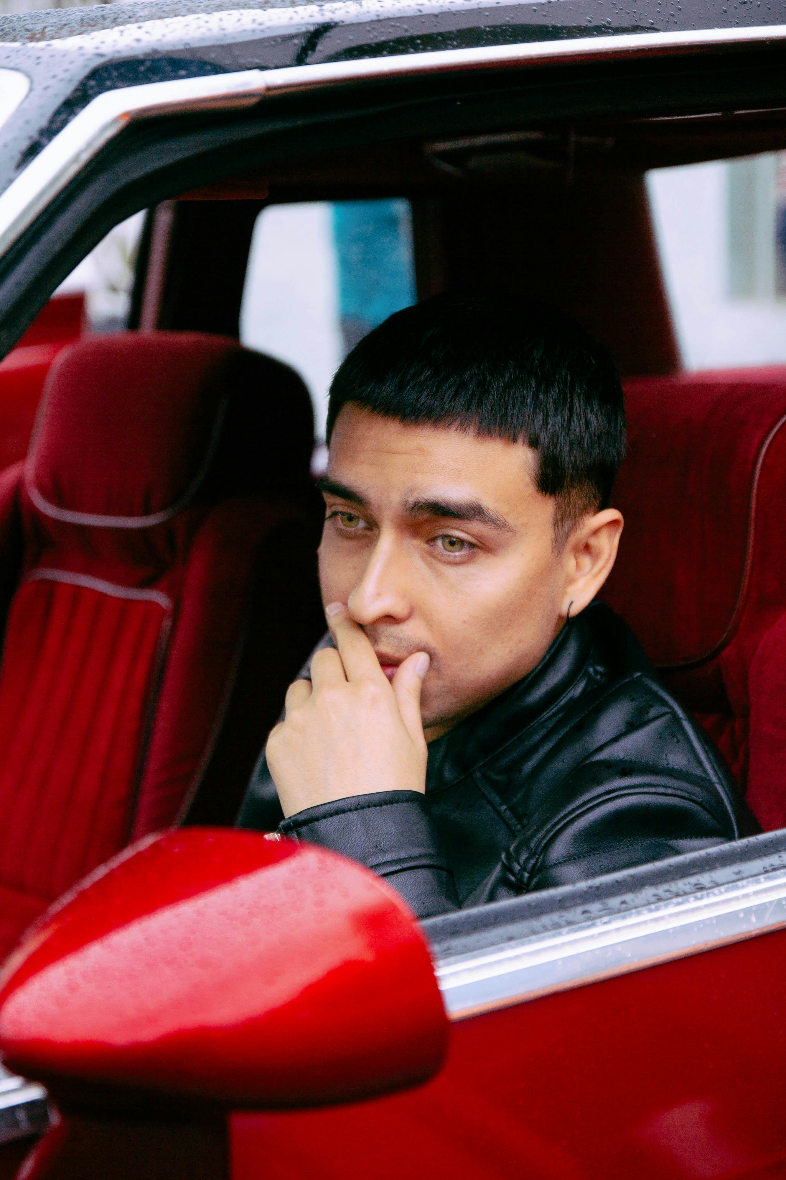 Pensive in Leather Jacket Sitting in Car · Free Stock Photo