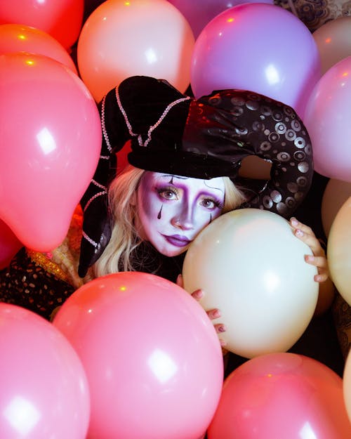 Woman in Costume among Balloons