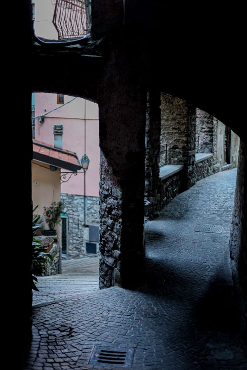 Free Discover a quaint cobblestone alley in Como, Italy, highlighting rustic architecture. Stock Photo