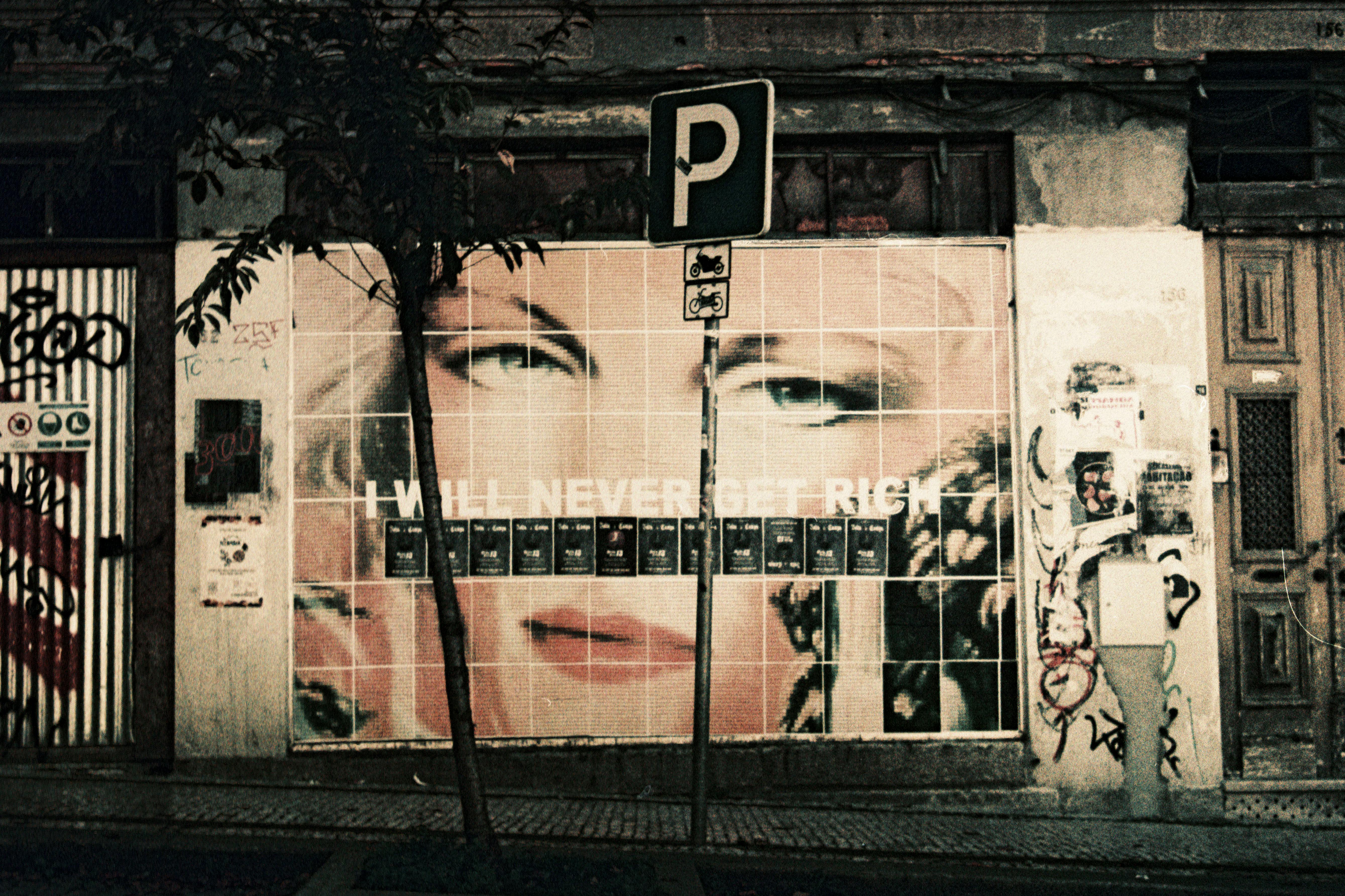 Graffiti on a city wall in Porto with a striking urban message and vibrant street art.