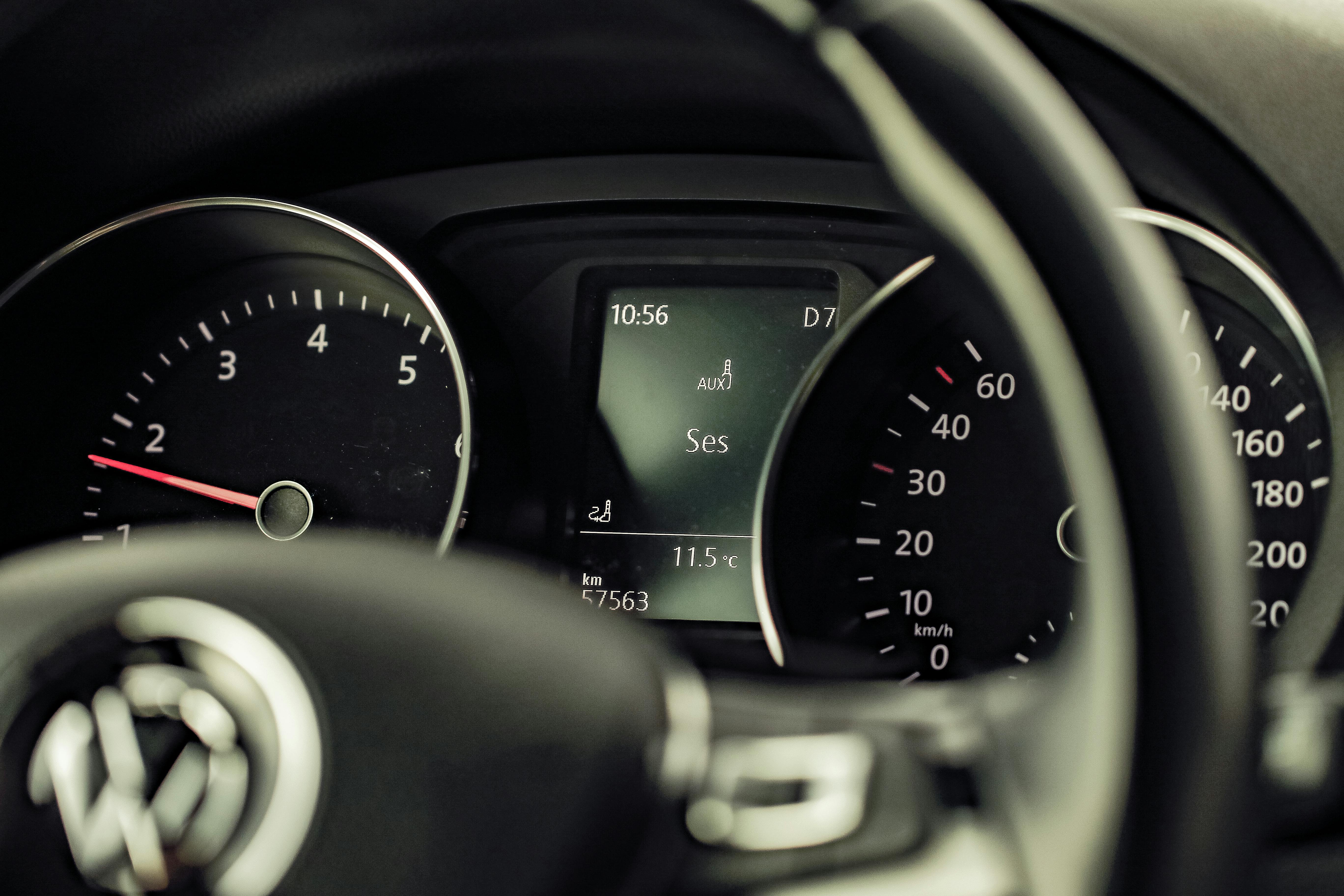 Detailed view of a Volkswagen car dashboard featuring speedometer and control display.