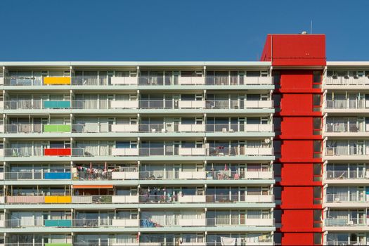 Vibrant facade of a modern apartment building showcasing colorful balconies and geometric design.