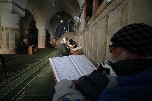Elderly Man Reading Quran in Mosque