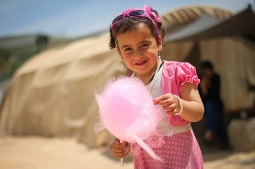 Little Girl Holding Cotton Candy 