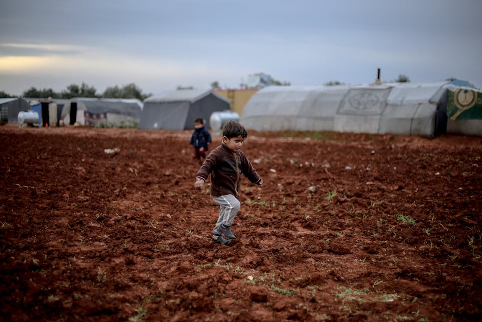 Children enjoying a moment of play in a Syrian refugee camp in Idlib, Syria.