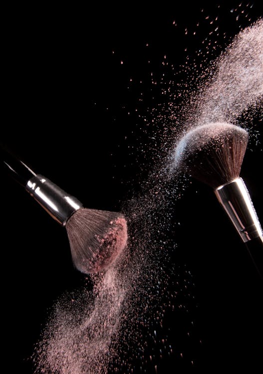 Free Cosmetics Makeup Brushes and Powder Dust Explosion Stock Photo