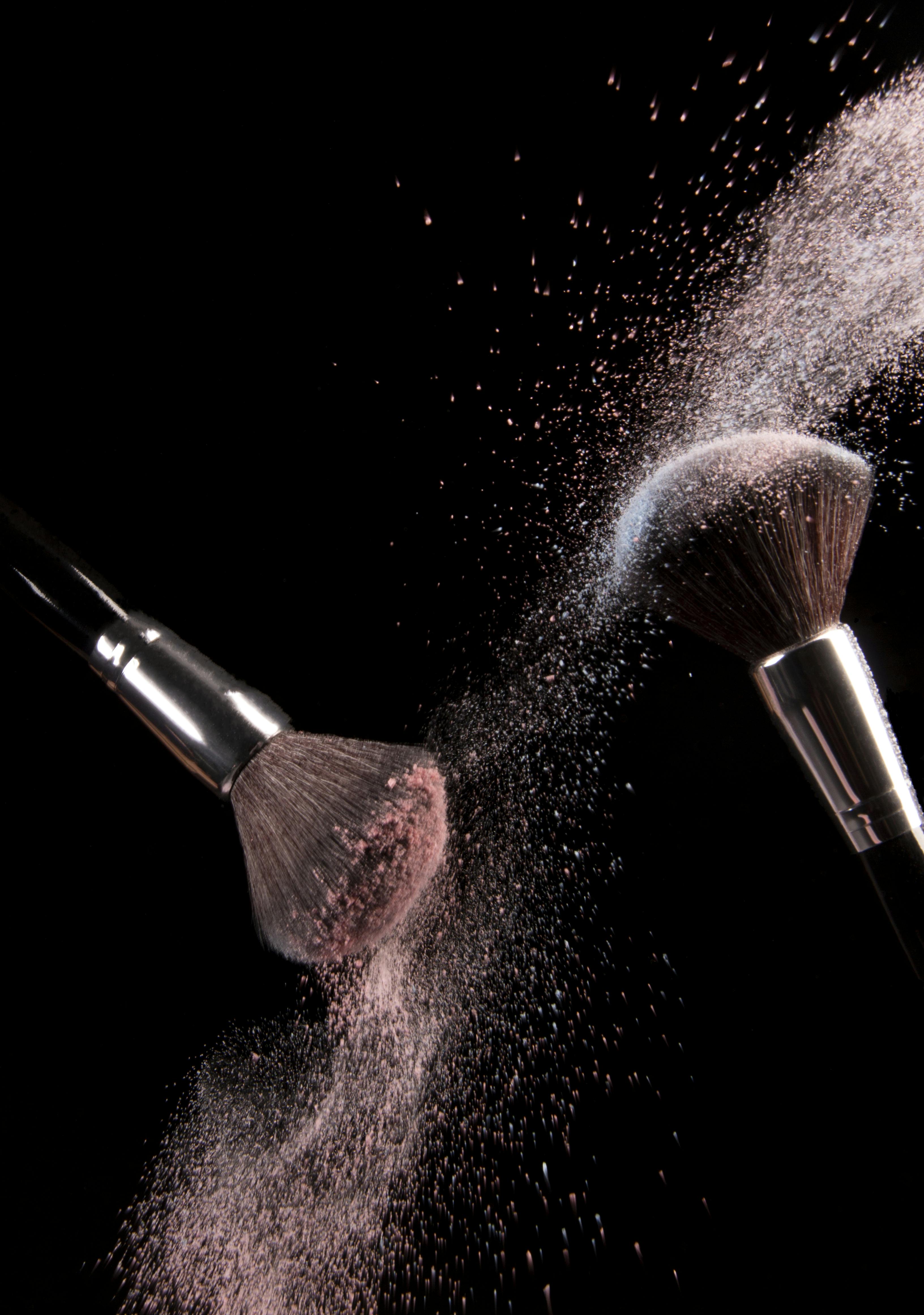 Cosmetics Makeup Brushes and Powder Dust Explosion · Free Stock Photo