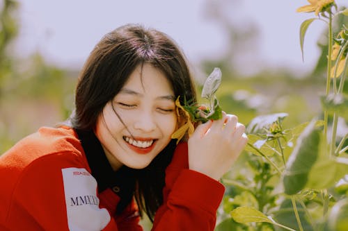 Fotos de stock gratuitas de asiática, cabello moreno, flor