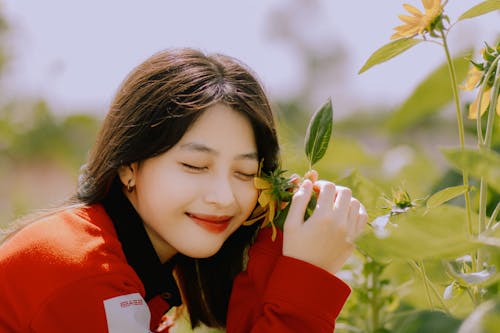 Fotos de stock gratuitas de asiática, cabello moreno, flor