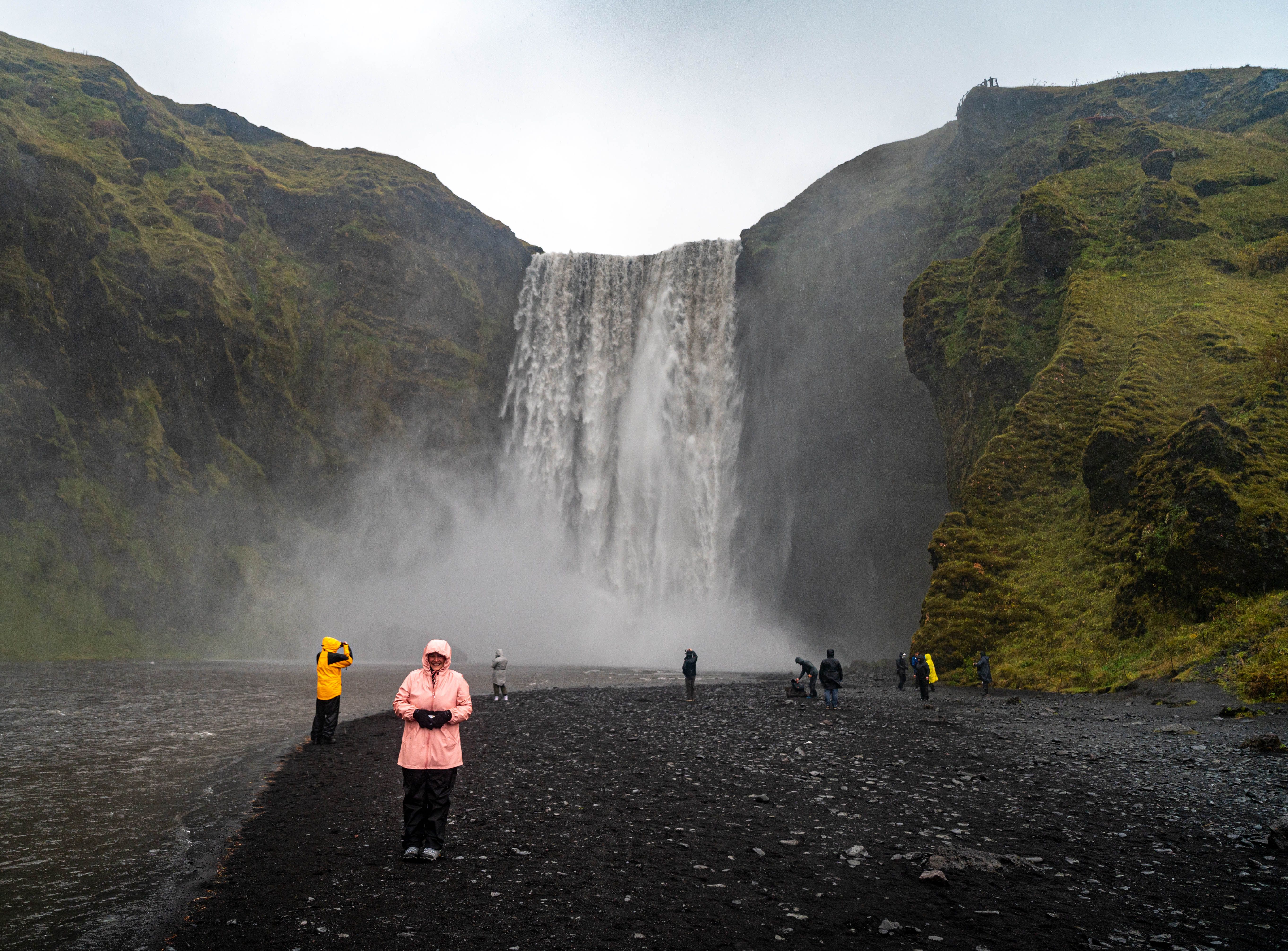 Visitors at the base of Skógafoss
