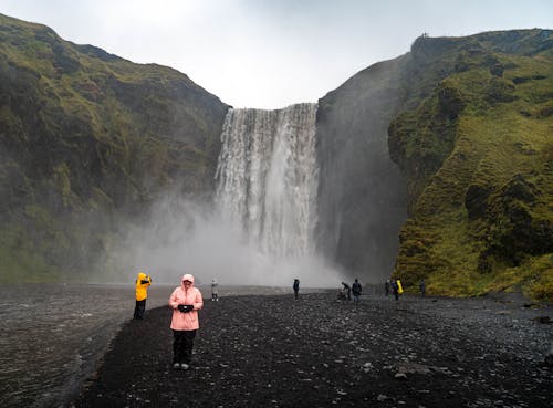 Tourists at the Foot of the Skogafoss Waterfall