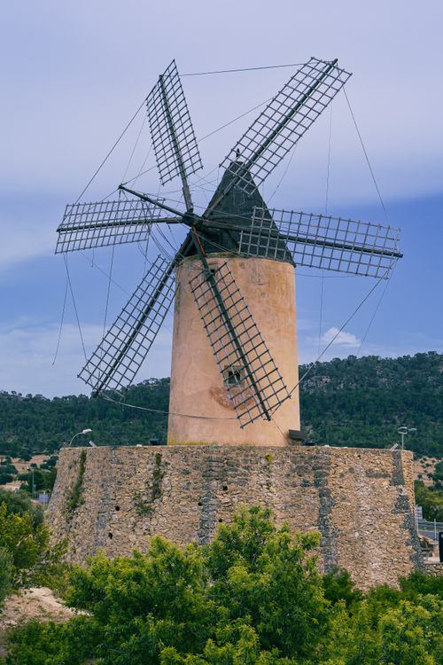 Free Scenic view of a historic windmill in Mallorca amidst a natural landscape. Stock Photo