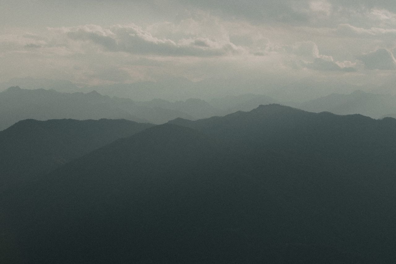 serene view of misty mountain ranges at dusk in mottarone italy
