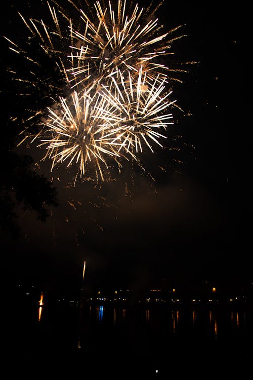 Yellow Fireworks Exploding against a Night Sky