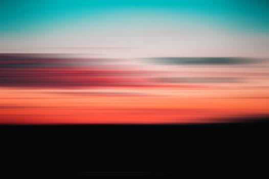 A vibrant and abstract blurred depiction of a sunset with stunning colors.