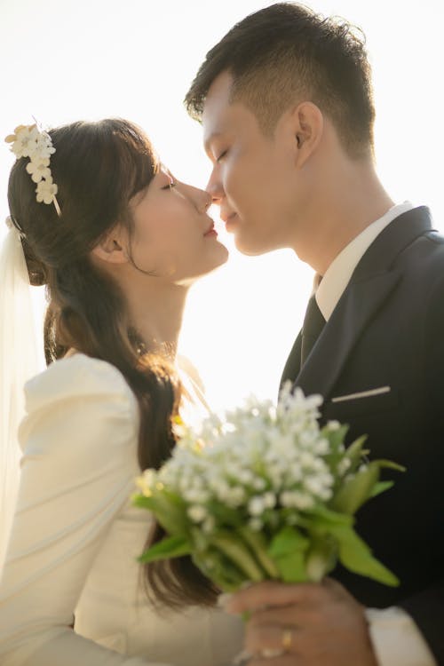 Newlyweds Together with Eyes Closed