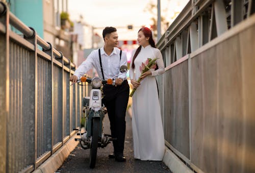 Woman with Man in Narrow Alley in Town