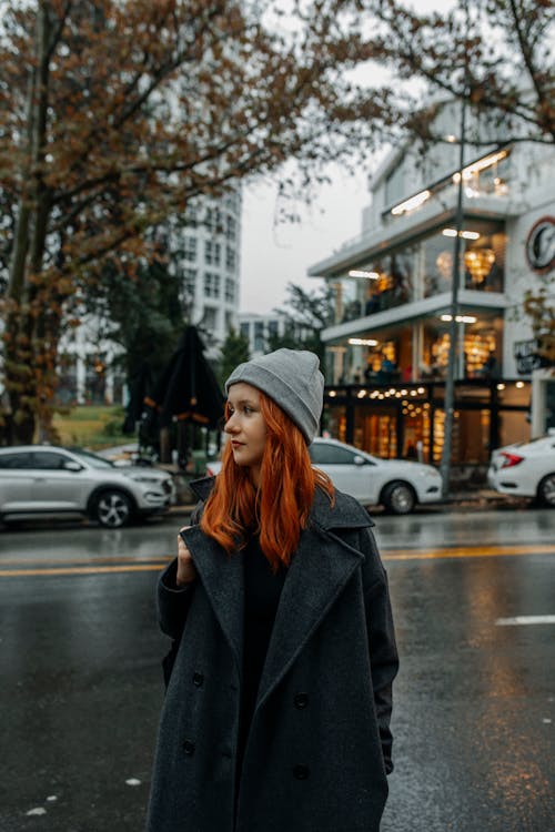 Beautiful Woman in Coat Standing on Street