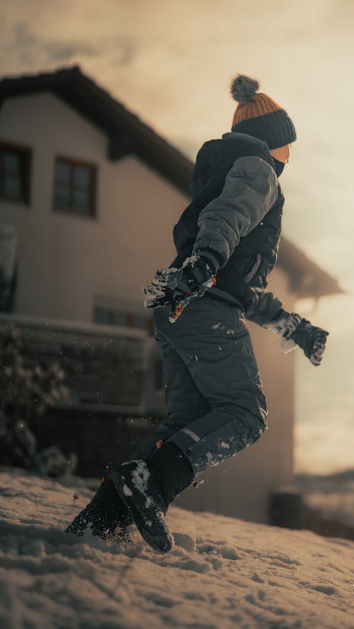 Boy Running in Snow