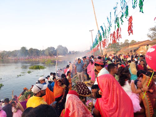 People around Lake in Ritual Celebration