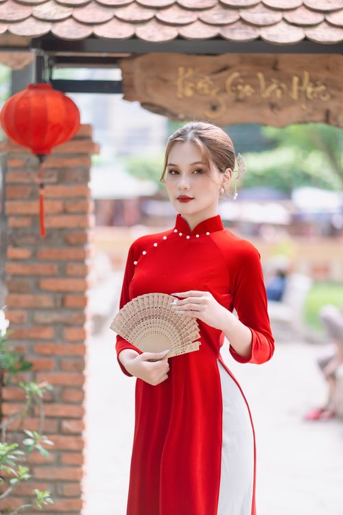 Young Woman in a Traditional Red Vietnamese Ao Dai Dress  Free Stock Photo