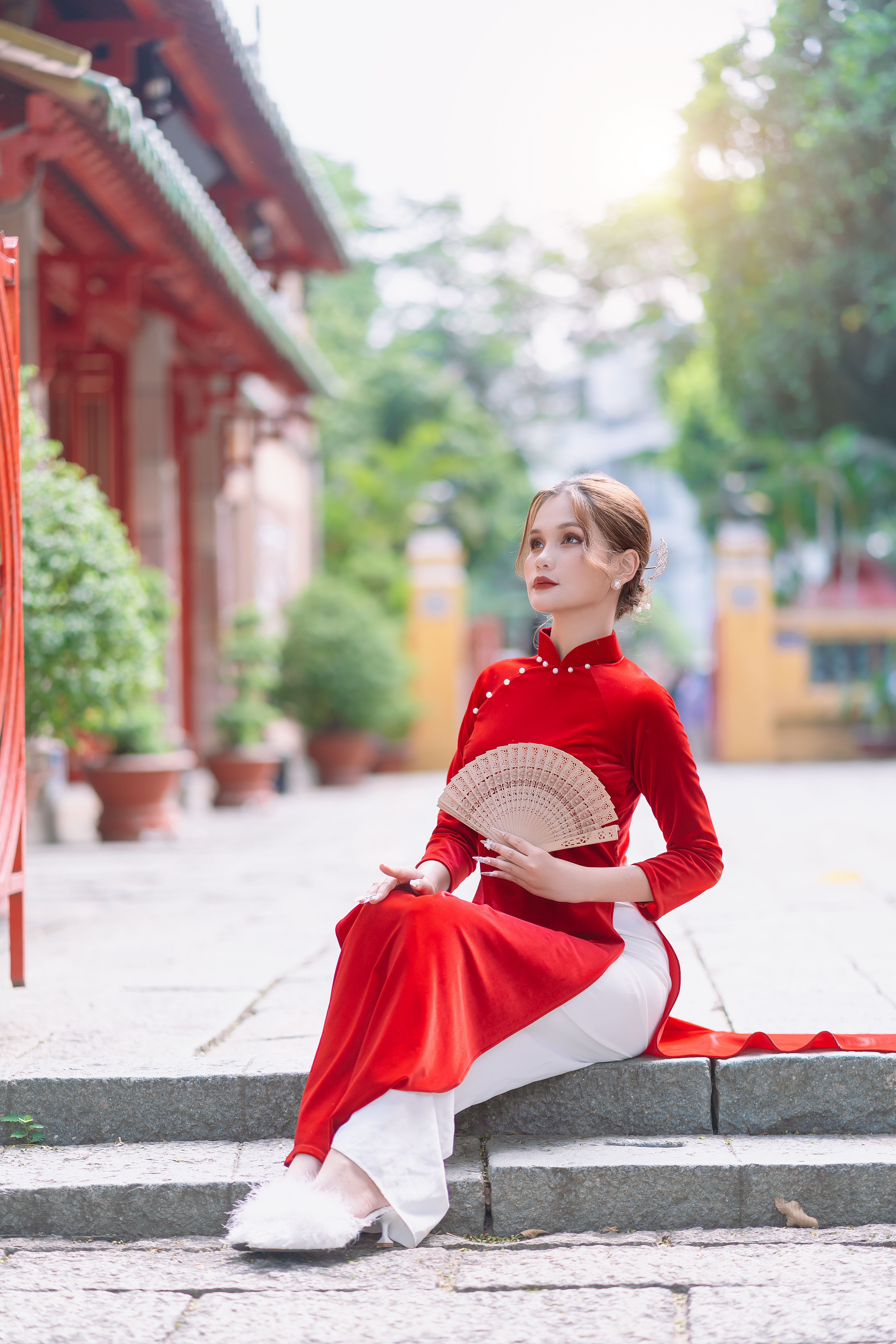 Woman in Long Red Dress Holding a Fan · Free Stock Photo