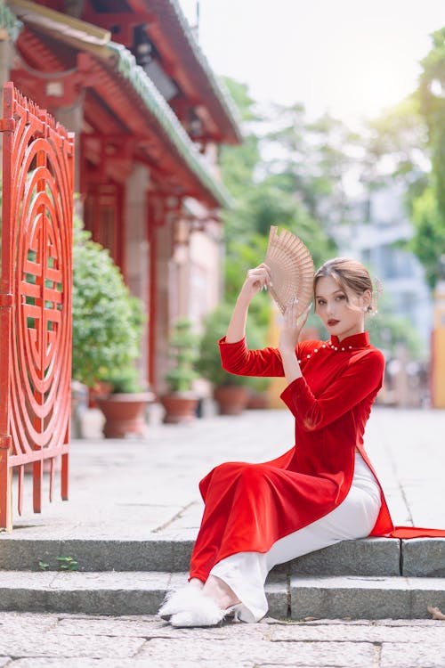 Woman Posing in Red Traditional Dress