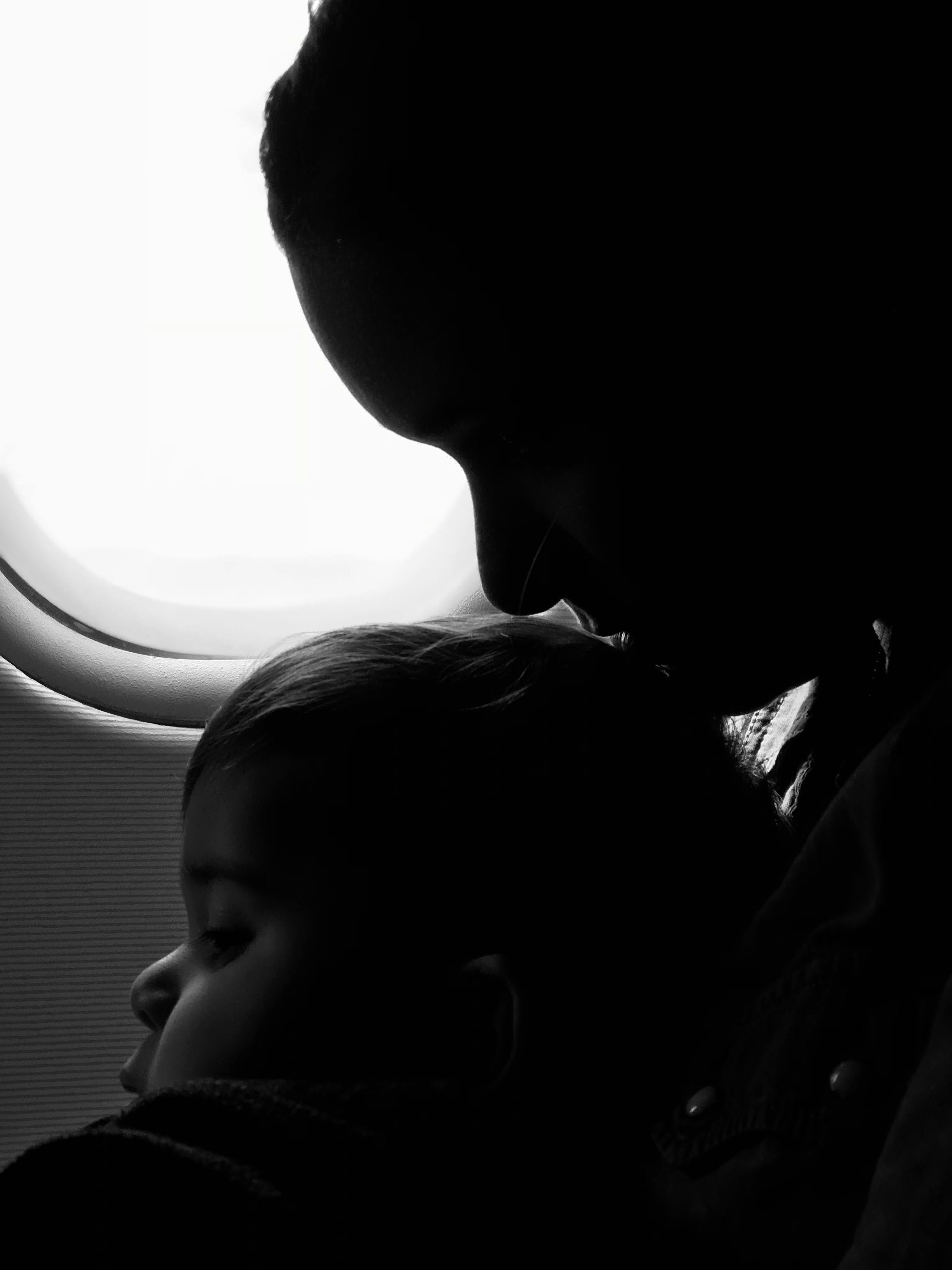 grayscale photography of woman and baby