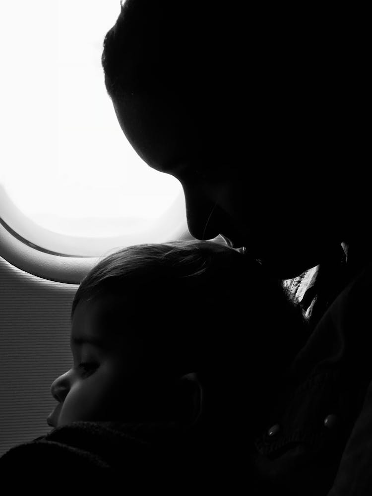 Grayscale Photography Of Woman And Baby