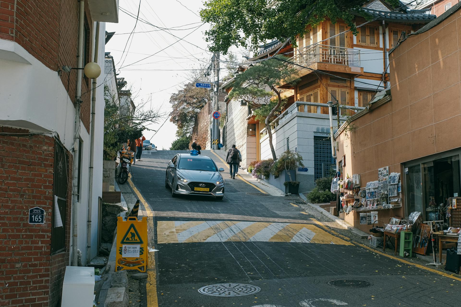 A Car on the Street in Bukchon Hanok Village in Seoul, South Korea