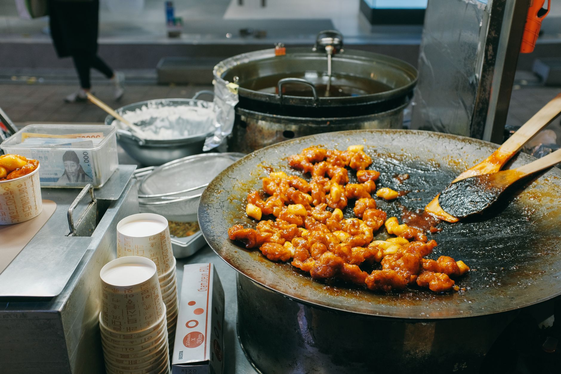 Gwangjang Market in Seoul, showing various food vendors and fresh produce