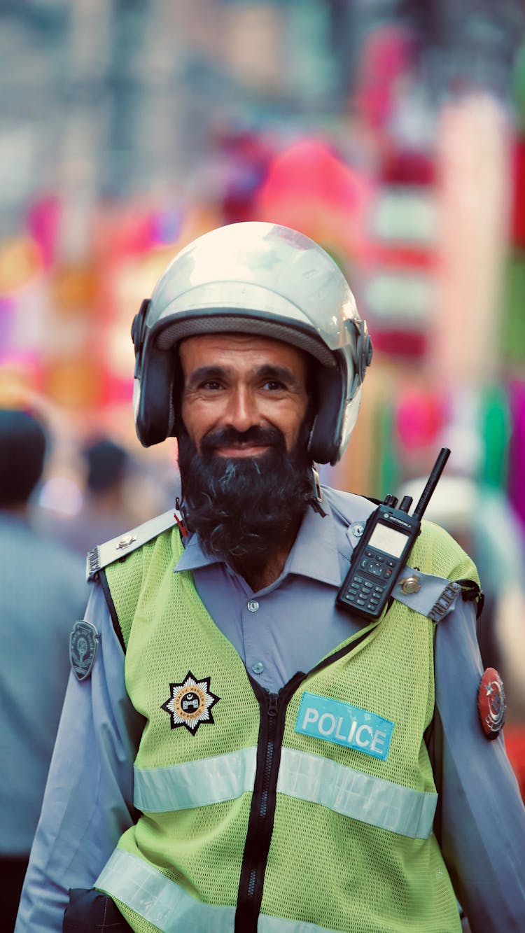 Portrait Of Policeman Wearing Helmet 