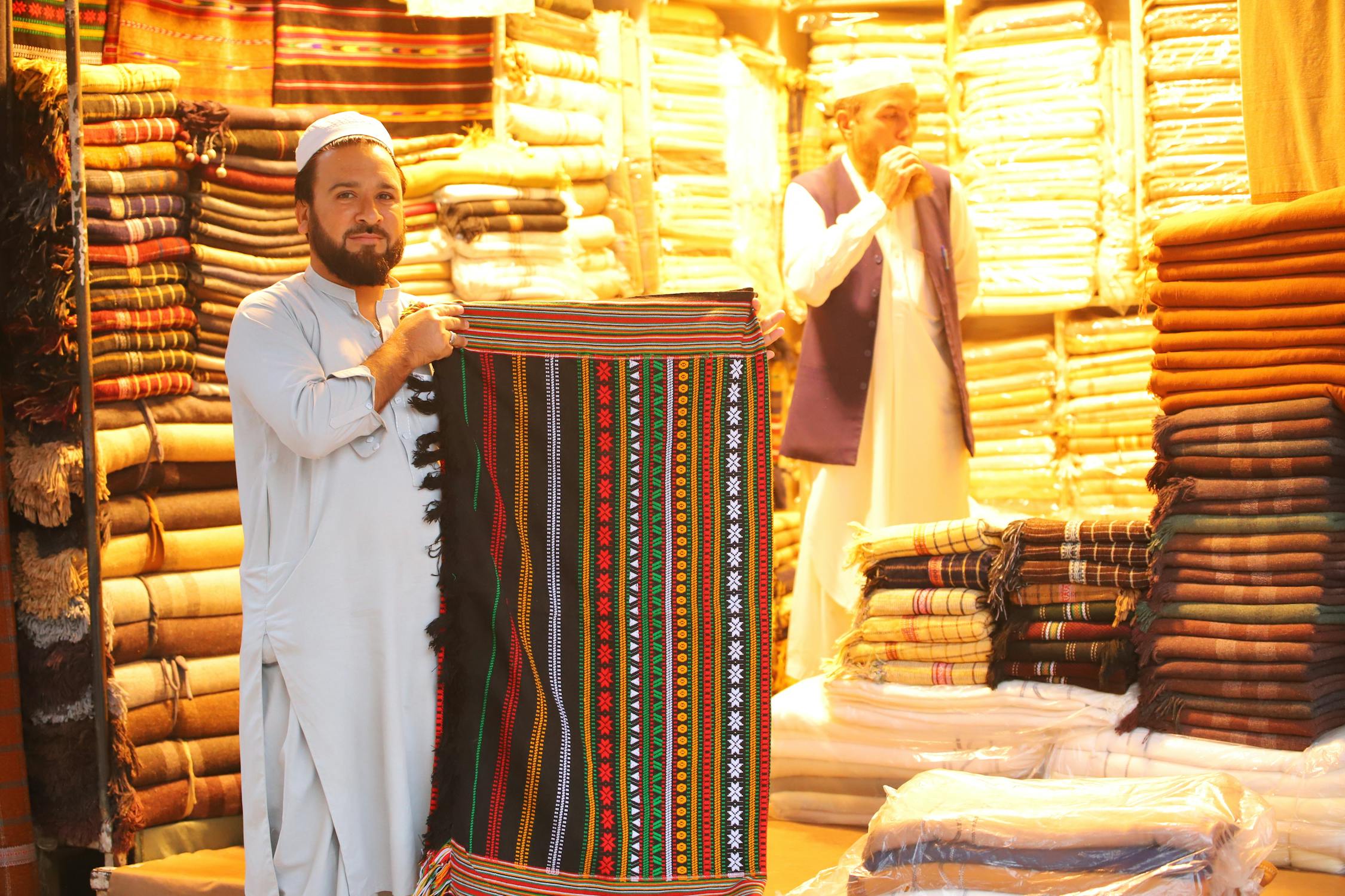 Men Selling Traditional Rugs on a Bazaar · Free Stock Photo