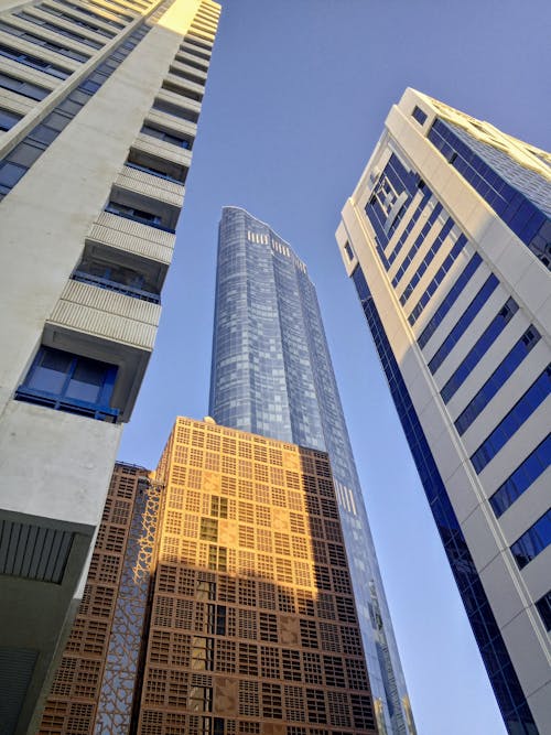 Free Low Angle Shot of Modern Skyscrapers in City  Stock Photo