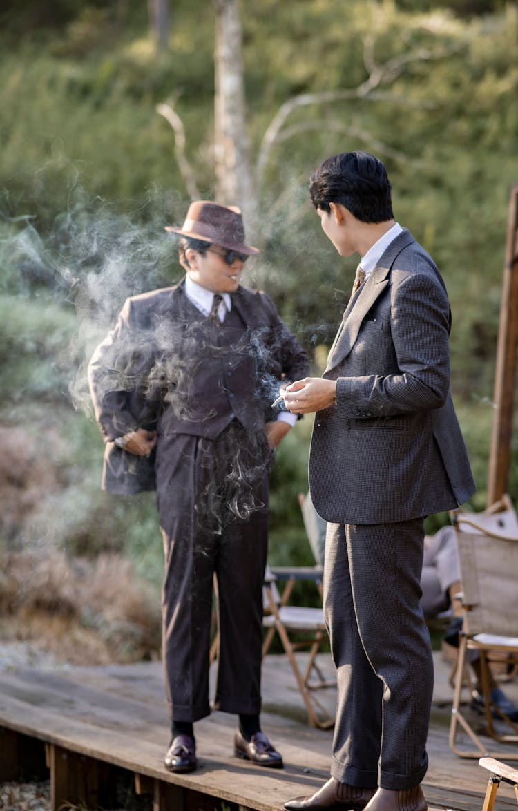 Men In Suits Smoking Cigarettes