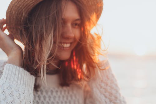Free Selective Focus Photo of Woman Wearing White Sweater Stock Photo