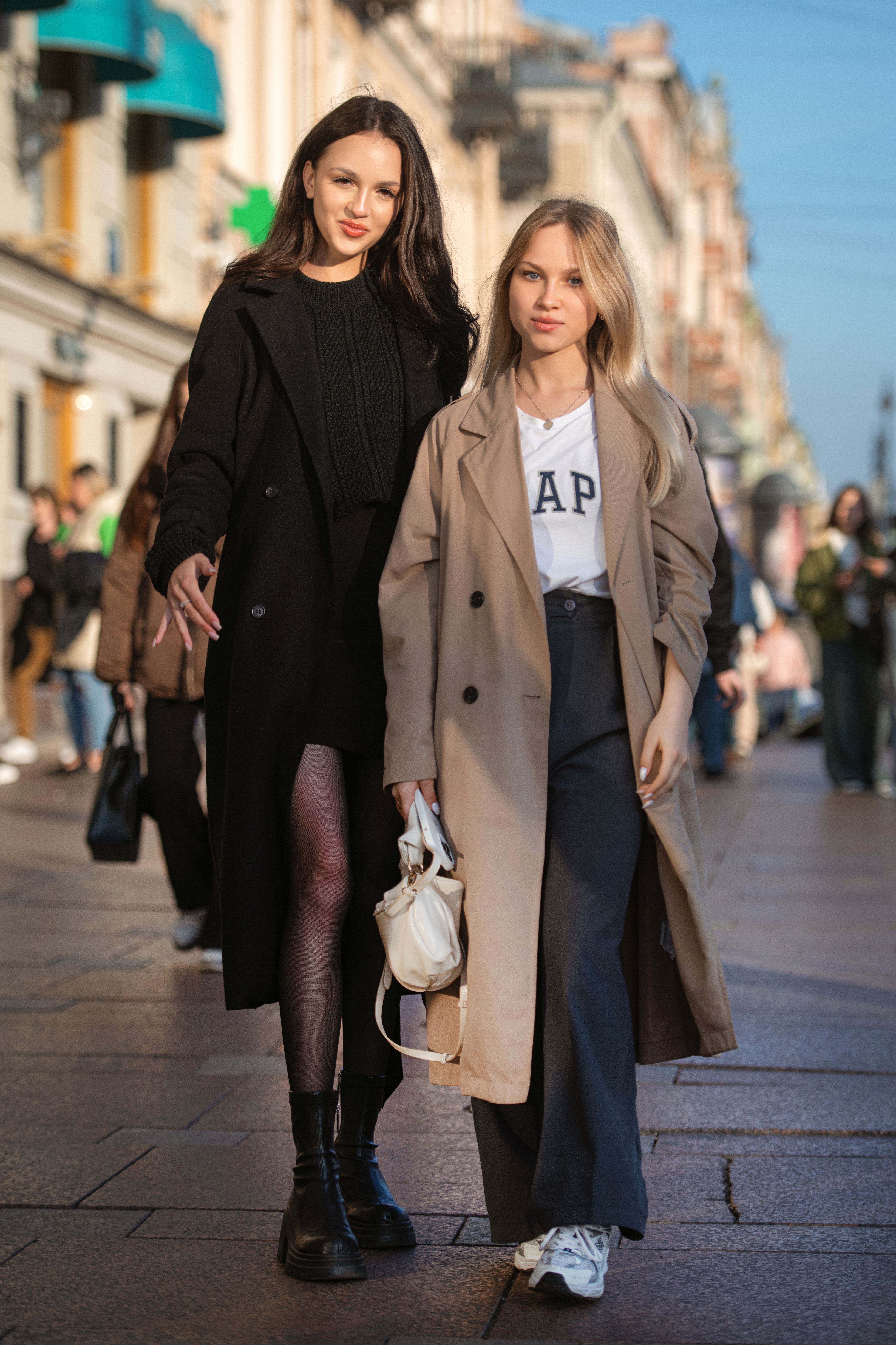 Two Young Fashionable Women Walking on a Sidewalk in City · Free Stock ...