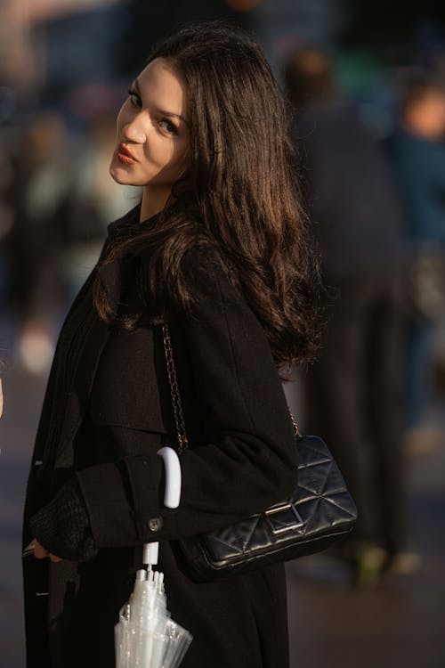 Woman in Black Coat and with Bag