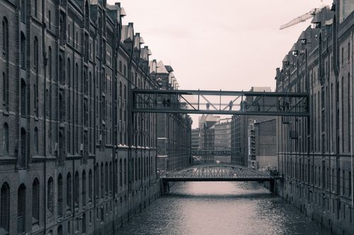 Free Monochrome view of Hamburg's iconic warehouse district with bridges and canals. Stock Photo