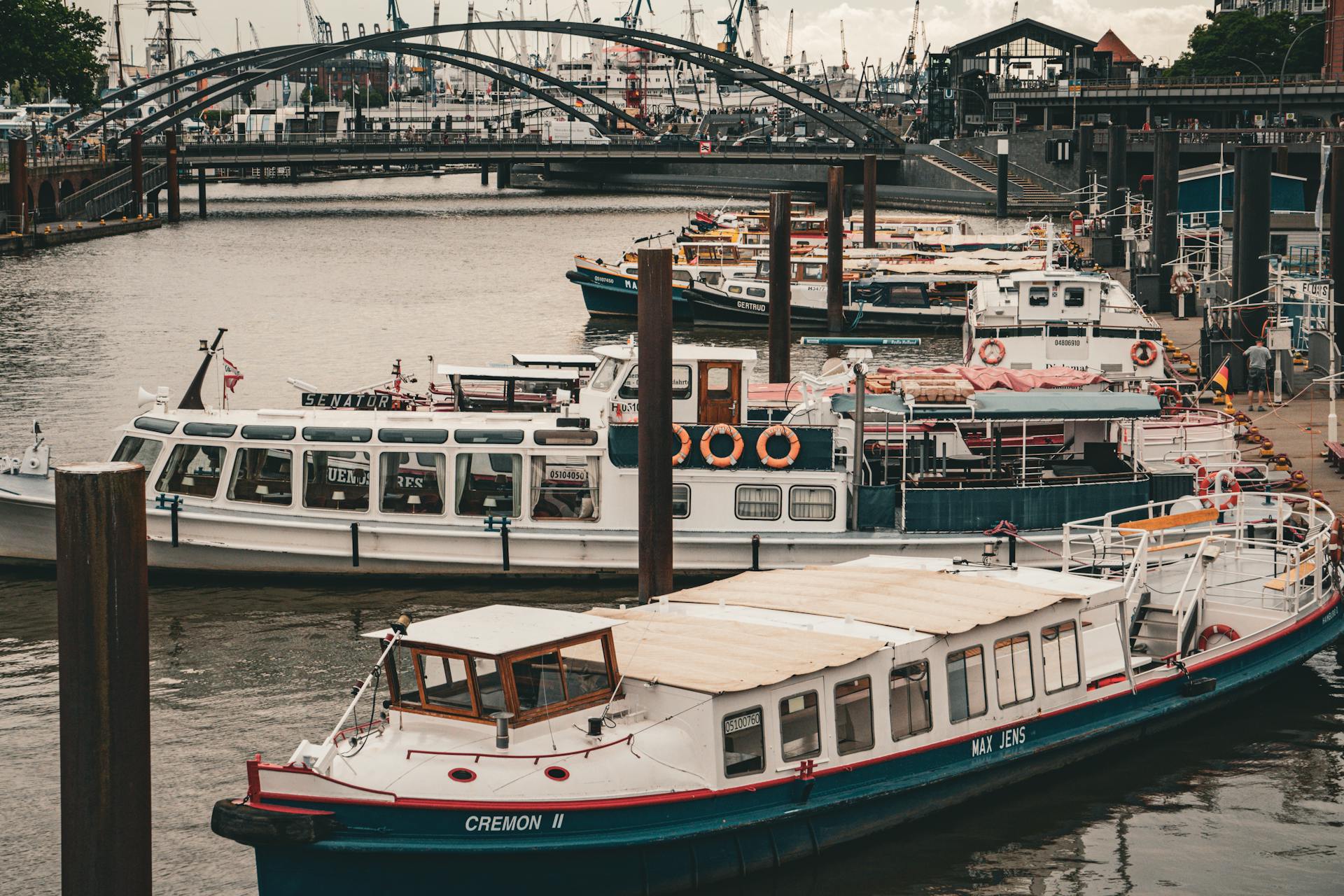 View of moored boats in the bustling Hamburg Harbor showcasing maritime life.