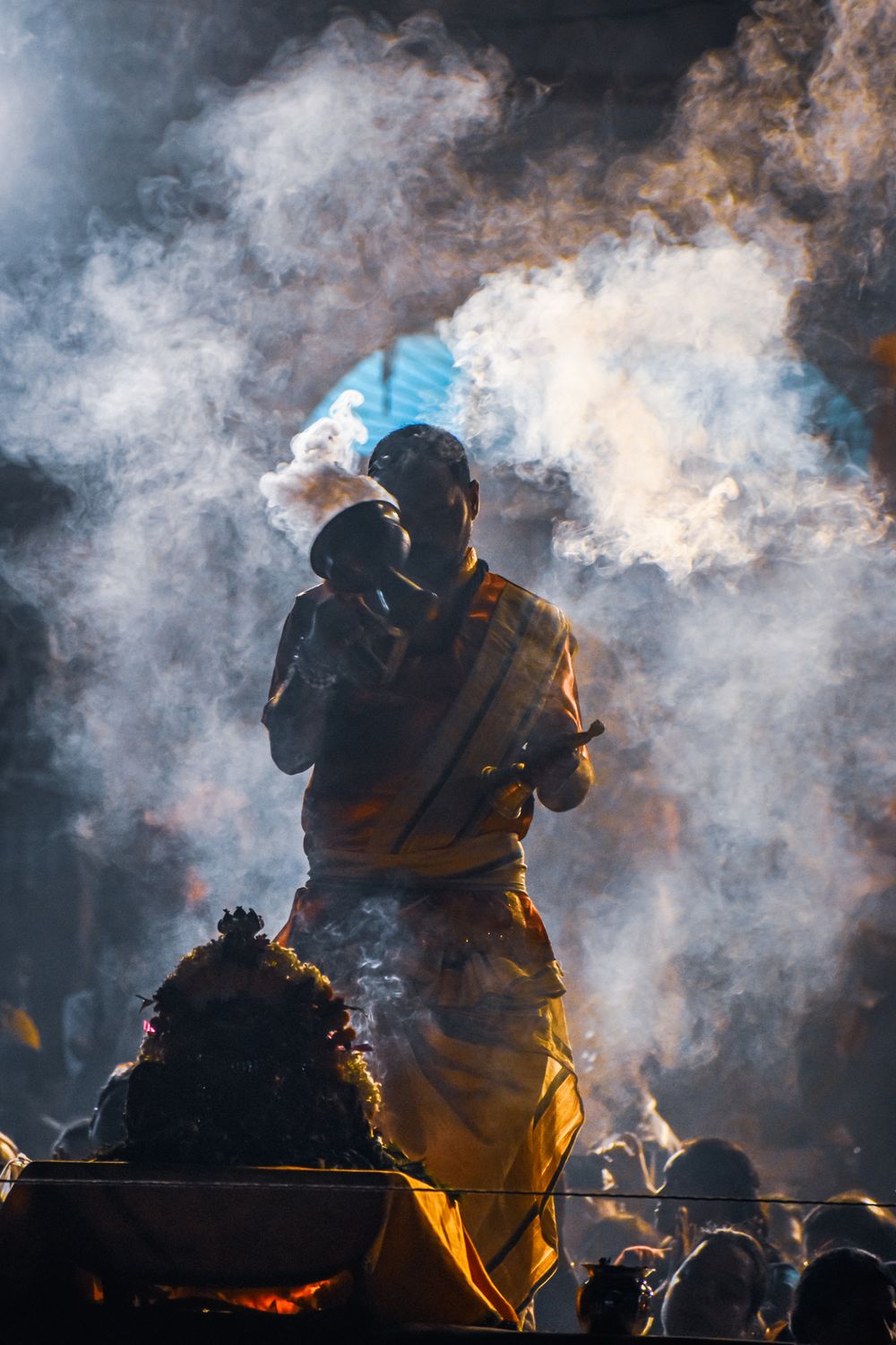 A Man in Traditional Clothes Standing in Smoke during a Traditional ...